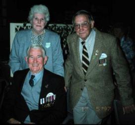 Ted Young, seated, with his wife Lucy and Alex Palmer in May 1997. Alex Palmer was the other 3rd Battalion soldier on the patrol. Image courtesy of Gavin Young. Ted Young, seated, with his wife Lucy and Alex Palmer in May 1997. Alex Palmer was the other 3rd Battalion soldier on the patrol. Image courtesy of Gavin Young.