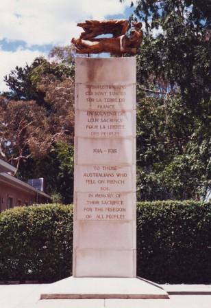 The 15 foot high French Australian memorial on Perth Avenue, Yarralumla, which consists of a sculpture sitting on top of a tall pillar.